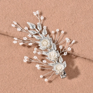 Silver bridal hair pins with white pearl leaves and metal flowers in a two-piece set