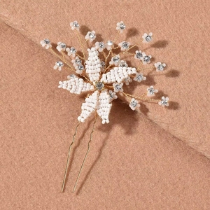 Handmade bridal hair pin featuring white beads, floral crystal petals, and gold wire