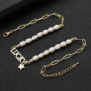 Collier élégant à nœud et perles dorées avec pendentif Lucky et étoile pour femme