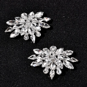 Elegant floral rhinestone shoe clips with sparkling marquise and pear crystals on black