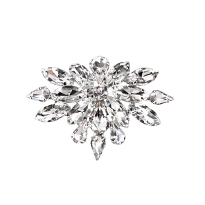 Macro shot of glass marquise crystal shoe clips with intricate floral rhinestone design