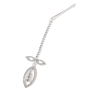 Close-up of silver hair clip with rhinestone bow and dangling teardrop crystal pendant