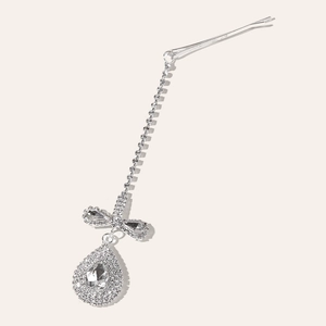 Detail of silver rhinestone forehead chain hair clip with sparkling water drop pendant