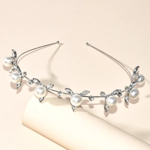 Elegant bridal crown headband with white pearls and crystals on a silver frame