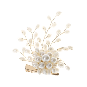 Macro view of French elegant pearl cluster brooch with gold-tone wire and duckbill clip