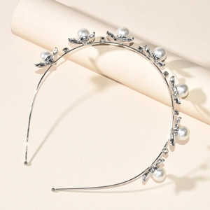 Elegant silver flower bridal headband with white pearls and crystals for wedding hairstyle