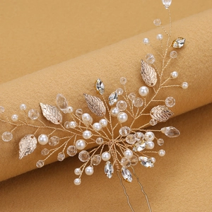 Golden bridal hair pin with leaf design, faux pearls and crystals for wedding hairstyle