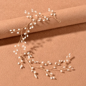 Handmade bridal hair vine with white beads and gold wire for wedding hairstyles