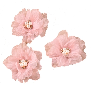 Set of three white pleated fabric flower hair clips with pearl and rhinestone centers