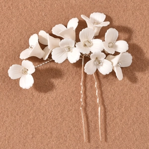 Handmade white floral U-shaped wedding hair pin with gold wire and clear bead accents