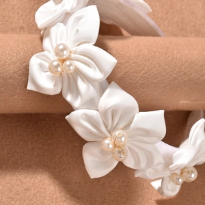 Elegant white satin floral headband with pearls for bridal wedding and event hair styling