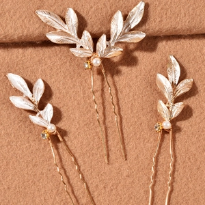 Set de trois épingles à cheveux dorées avec perles blanches et strass scintillants