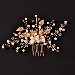 Exquisite gold bridal hair comb with elegant crystal leaves and faux pearls for weddings