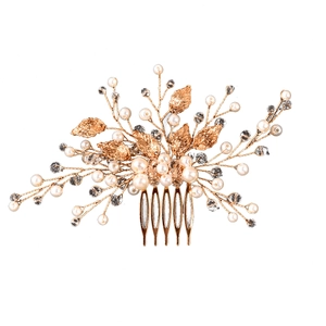 Elegant gold bridal hair comb featuring crystal leaves and delicate pearls for wedding hair