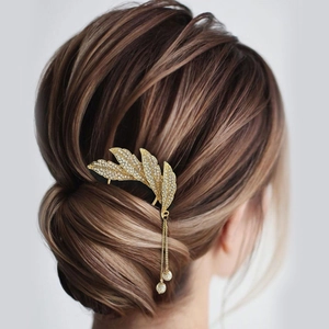 Elegant gold leaf hair comb with sparkling rhinestones and white pearl tassels