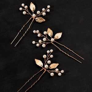 Set of 3 gold leaf hair pins with pearls and textured leaves for wedding hairstyles