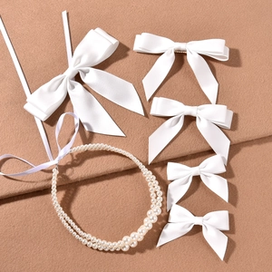 Elegant bridal hair set with white satin bows and double layer pearl headband