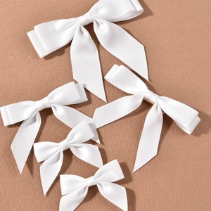 Elegant set of white satin bow hairpins in various sizes for bridal wedding accessories
