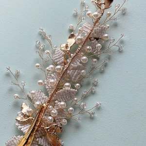 Exquisite rose gold bridal hairpiece with pearls and crystals for wedding hairstyles