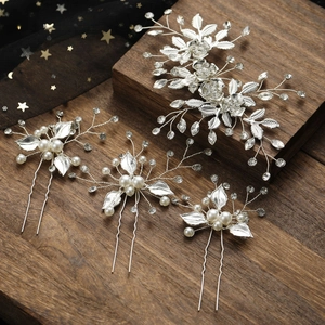 Elegant silver bridal hair accessory set with floral crystal patterns and pearl hair pins