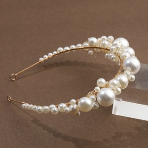 Elegant gold bridal headband with layered white pearls for wedding hair styling