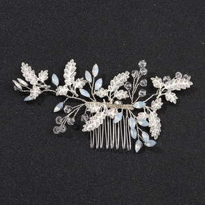 Elegant bridal hair comb with silver leaf patterns, rhinestones and crystal beads