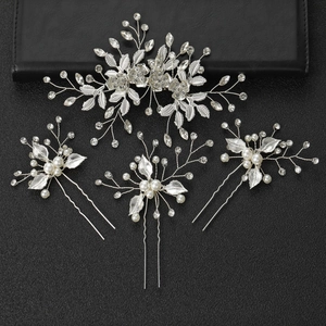 Silver bridal hair clip and 3 pins set with crystals and pearls on black background