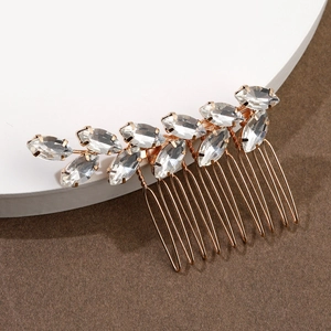 Elegant rose gold bridal hair comb with marquise crystal leaf design on a white pedestal