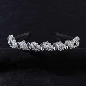 Elegant bridal crystal flower headband with marquise rhinestones on textured black backdrop