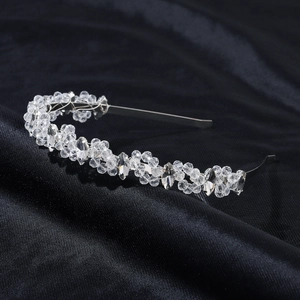 Macro shot of bridal crystal headband featuring silver metal and faceted clear beads