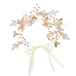 Handmade bridal hair vine with golden leaf motifs and amber crystals on white ribbons