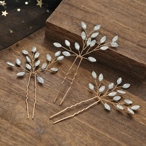 Three-piece gold wire bridal hair pins with opal-like leaf ornaments for wedding styles