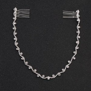 Silver bridal hair chain with sparkling rhinestones and metal combs for weddings