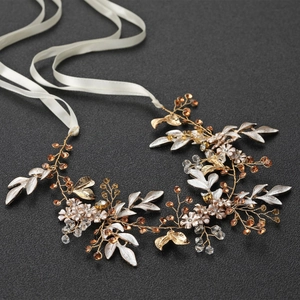 Elegant bridal headpiece with golden leaves, white enamel flowers and crystals with ribbons