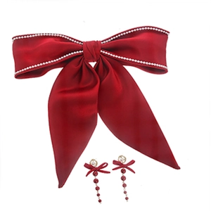 Elegant red bow hair clip and long tassel earrings set with white pearl accents