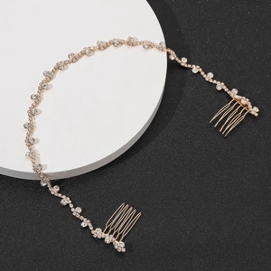 Detail of bridal hair vine with sparkling rhinestones and gold alloy double combs