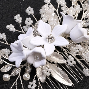 Exquisite bridal hair comb with white matte flowers, pearls and silver leaf accents