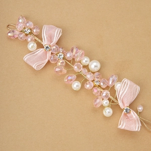 Handmade pink crystal and pearl wrist corsage with ribbon bows for bridal and bridesmaids