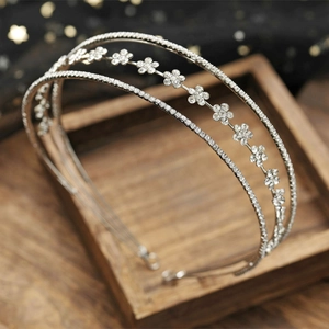 Silver double-layered bridal headband with rhinestone flowers and shimmering crystals