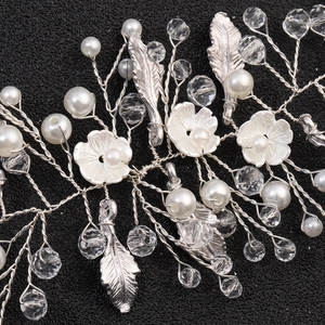 Handmade silver hair band with white pearls, crystals, and delicate flower petals