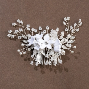 Elegant bridal hair comb with white handmade flowers, rhinestones, and pearls on silver wire