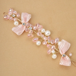 Pink crystal wrist flower with faux pearls and ribbon bows for bridal bridesmaids