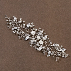 Silver flower hair vine with pearls, crystals, and white petals for bridal hairstyles