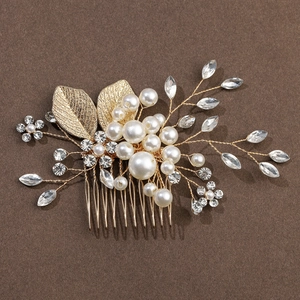 Elegant gold leaf hair comb with white pearls and crystals for wedding hair styling