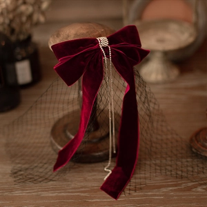 Vintage burgundy velvet bridal bow hairpiece with rhinestone tassels and mesh veil
