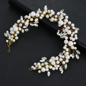 Detail of bridal hair vine with pearls and marquise crystals on gold wire