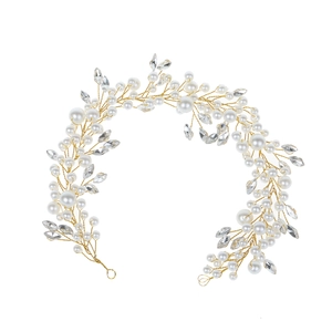 Elegant gold bridal hair vine with white pearls and marquise cut crystal accents