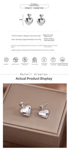 Detailed macro view of 925 sterling silver heart earrings on a premium leather jewelry box