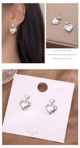 Detail showing S925 sterling silver heart earrings worn by a model and close-up views