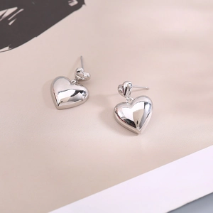 Elegant silver heart-shaped double-layered dangle earrings with smooth mirror-polished finish